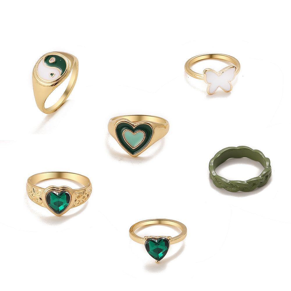 Damen modisches Mehrfach-Ringset mit bunten und symbolischen Designs Shop Nory
