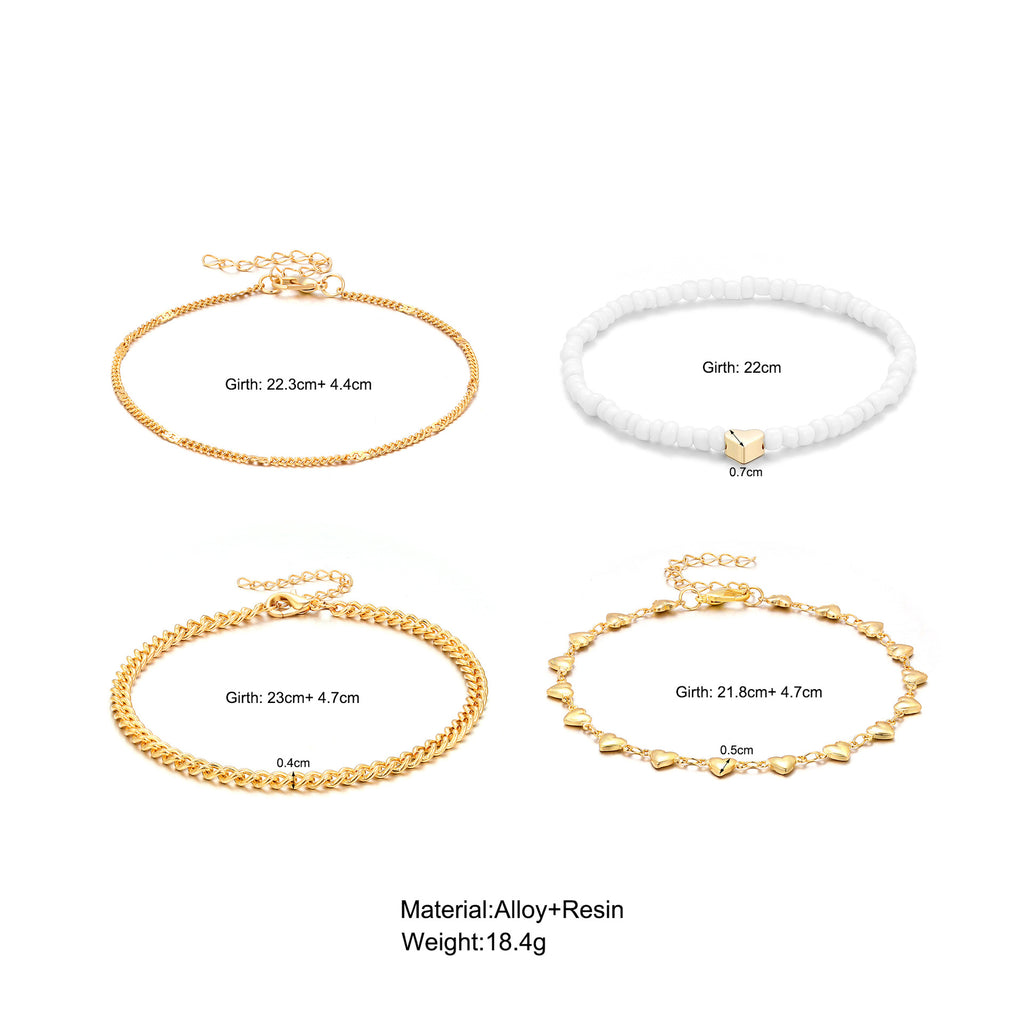 Damen Fußkettchen-Set mit eleganten goldenen und weißen Akzenten Shop Nory