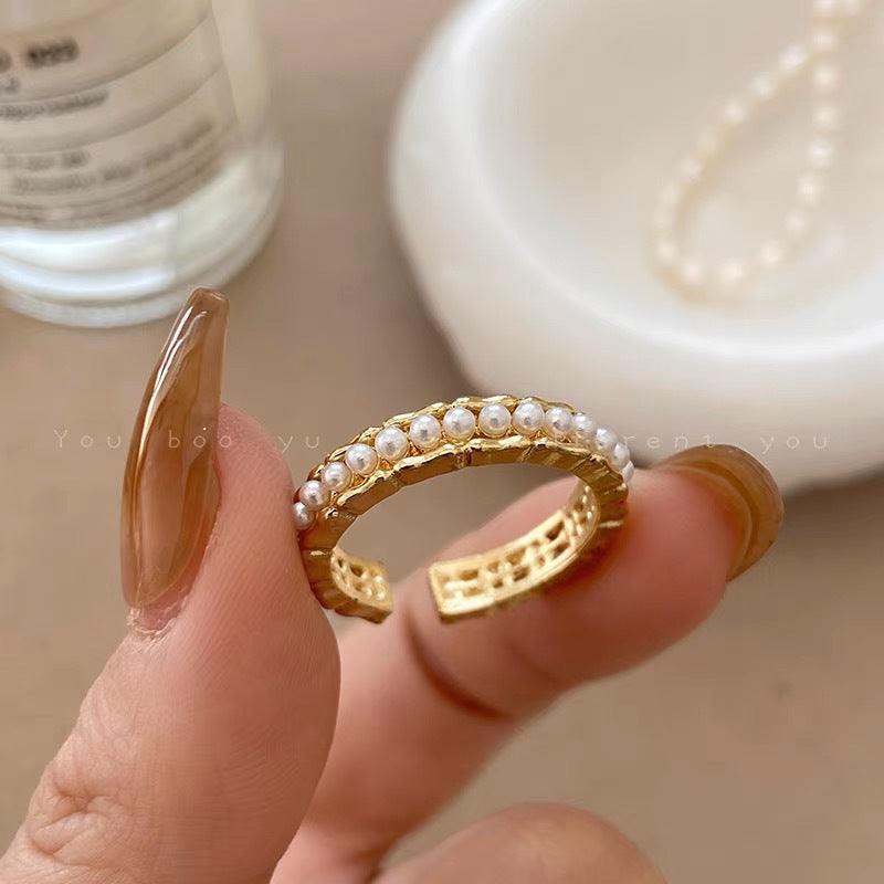 Damen Ring mit filigranem Perlendesign und elegantem Goldfinish Shop Nory