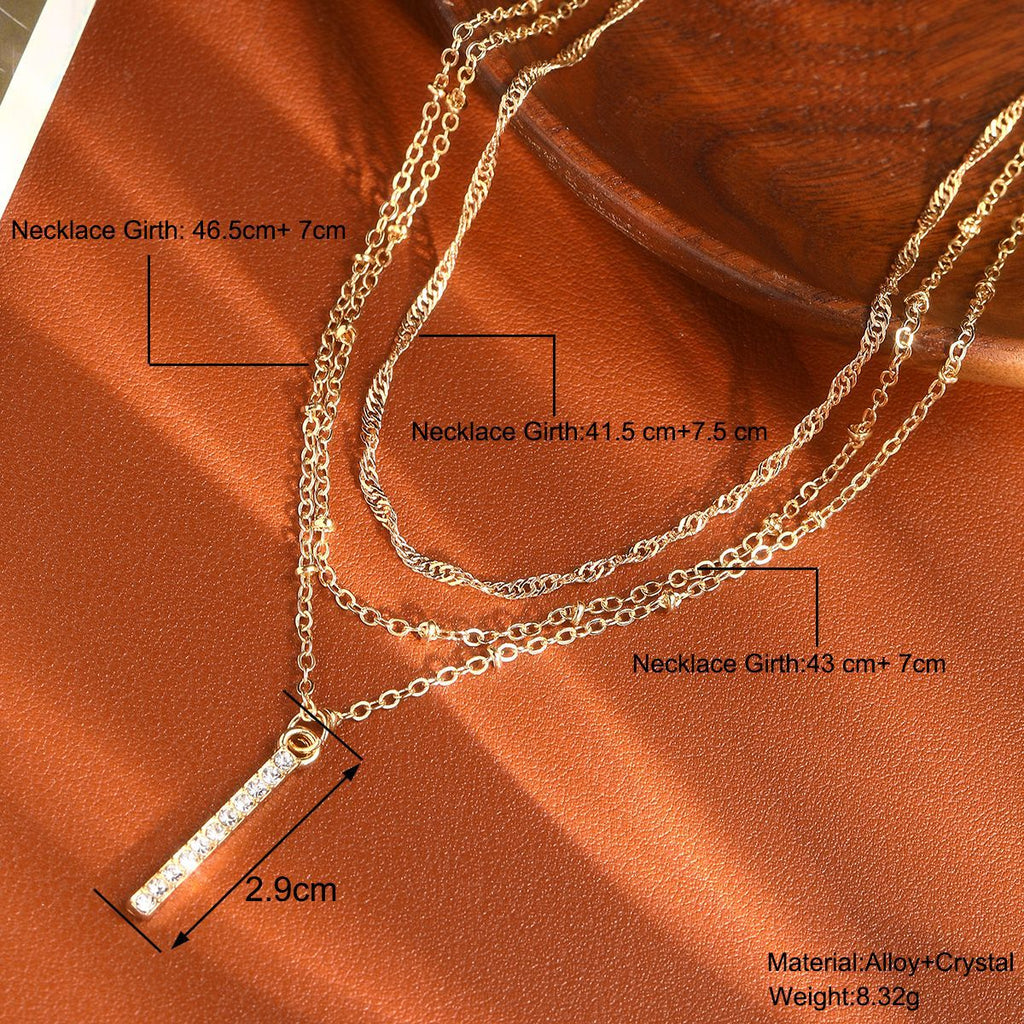 Damen mehrlagige Kette mit funkelndem Anhänger und filigranen Details Shop Nory