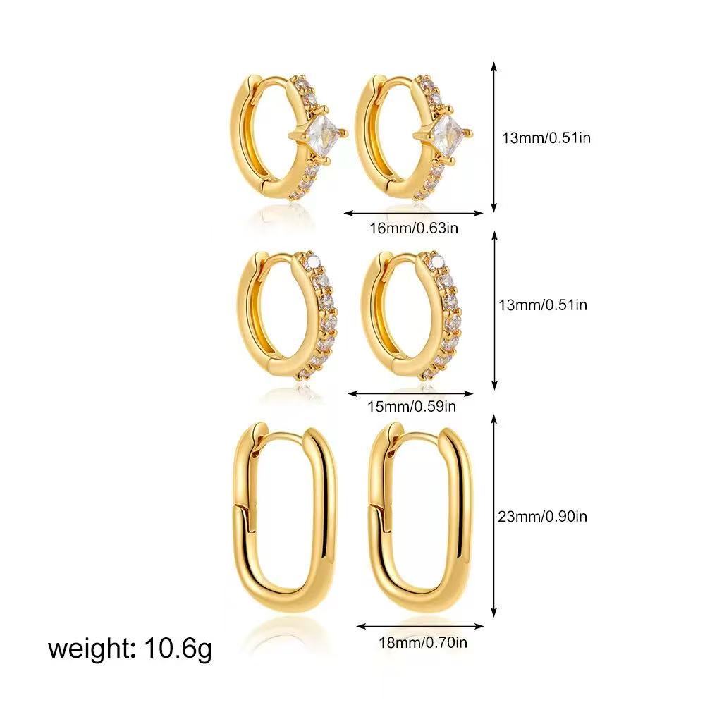 Damen Ohrringe mit funkelnden Zirkonia-Anhängern und zartem Kettendesign Shop Nory
