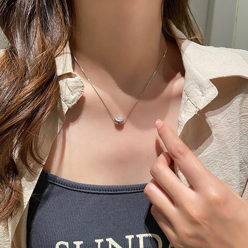 Damen Halskette mit modernem Bohnenanhänger aus hochwertigem Edelstahl Shop Nory