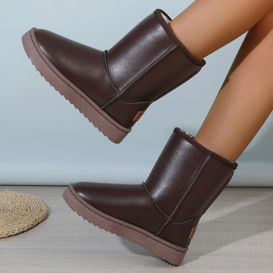 Damen Winterstiefel mit Teddyfutter, Lederoptik und flacher Plateau‑Sohle Shop Nory
