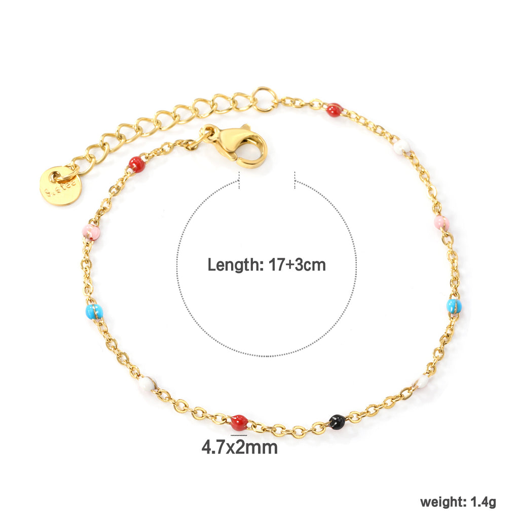 Damen zartes goldplattiertes Armband mit roten Akzenten Shop Nory