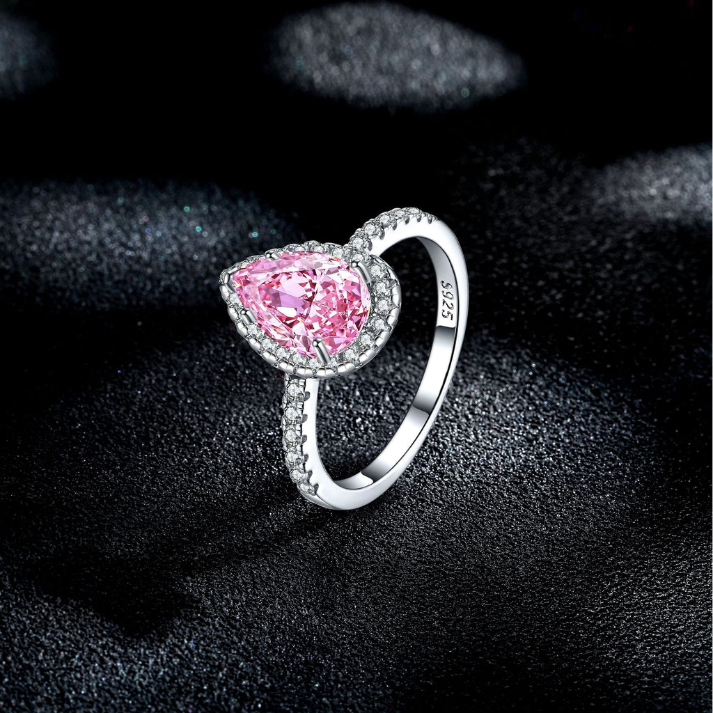 Damen eleganter Tropfenring mit funkelndem aquablauem Hauptstein und Zirkonia-Besatz Shop Nory