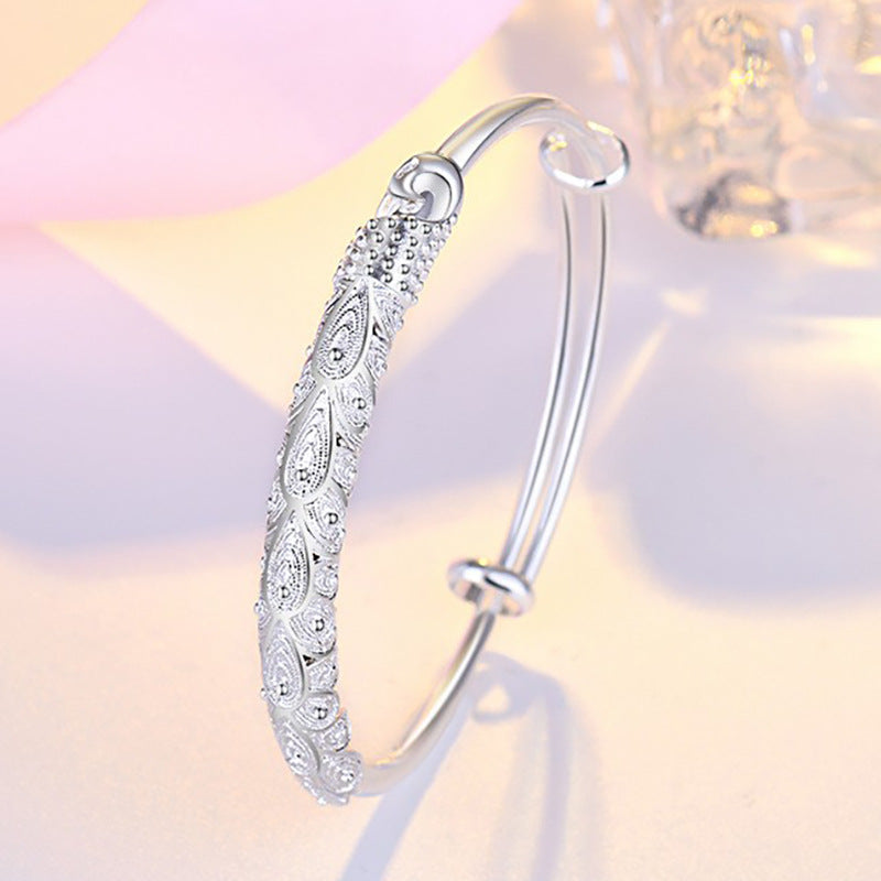 Damen Elegantes Armreif mit kunstvollem Federmotiv Shop Nory