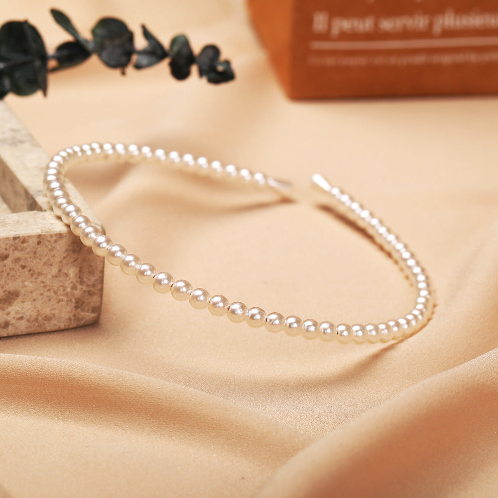 Damen Haarband mit eleganten Perlenverzierungen Shop Nory