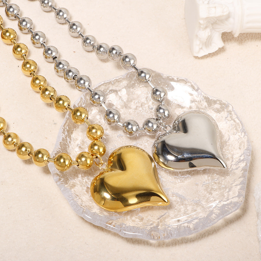 Damen Halskette mit glänzendem Herzanhänger und feinem Perlen-Design Shop Nory