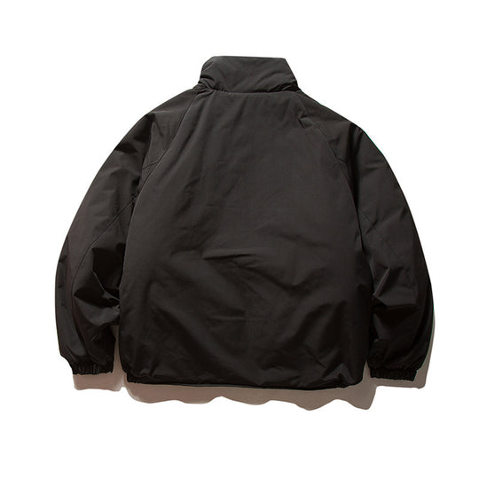 Unisex Boxy Wattierte Übergangsjacke mit hohem Stehkragen, elastischen Bündchen und aufgesetzten Klappentaschen Shop Nory