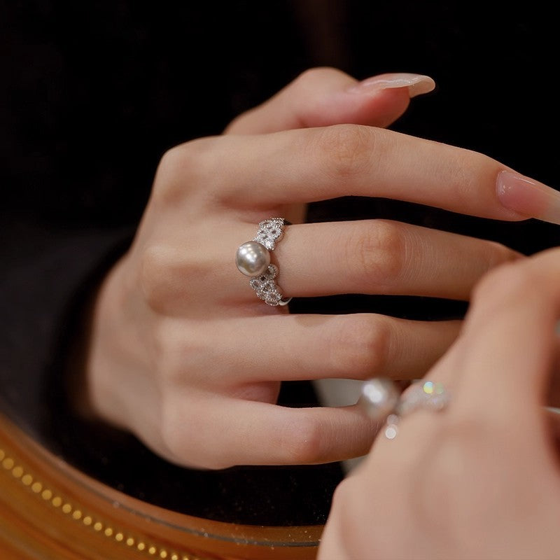 Damen eleganter Ring mit funkelnden Kristallen und Perle Shop Nory