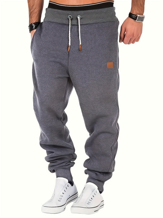 Herren melierter Relax-Jogger mit breitem Komfortbund, gedrehtem Kordelzug und gerippten Knöchelabschlüssen Shop Nory