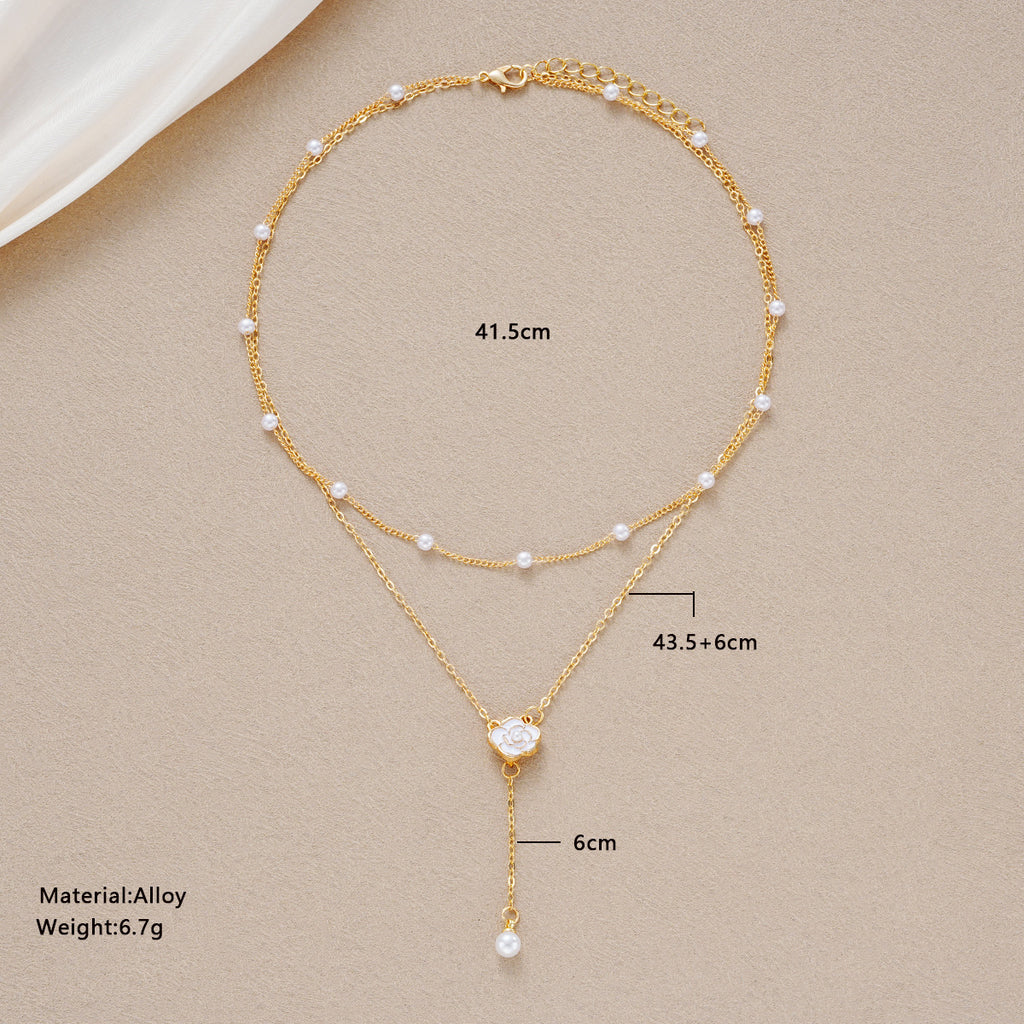 Damen Halskette mit eleganten Perlen- und Blumenakzenten Shop Nory