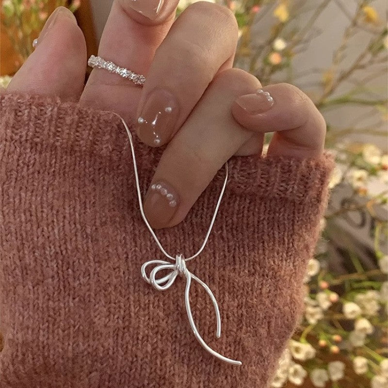 Damen Halskette mit elegantem Schleifenanhänger Shop Nory