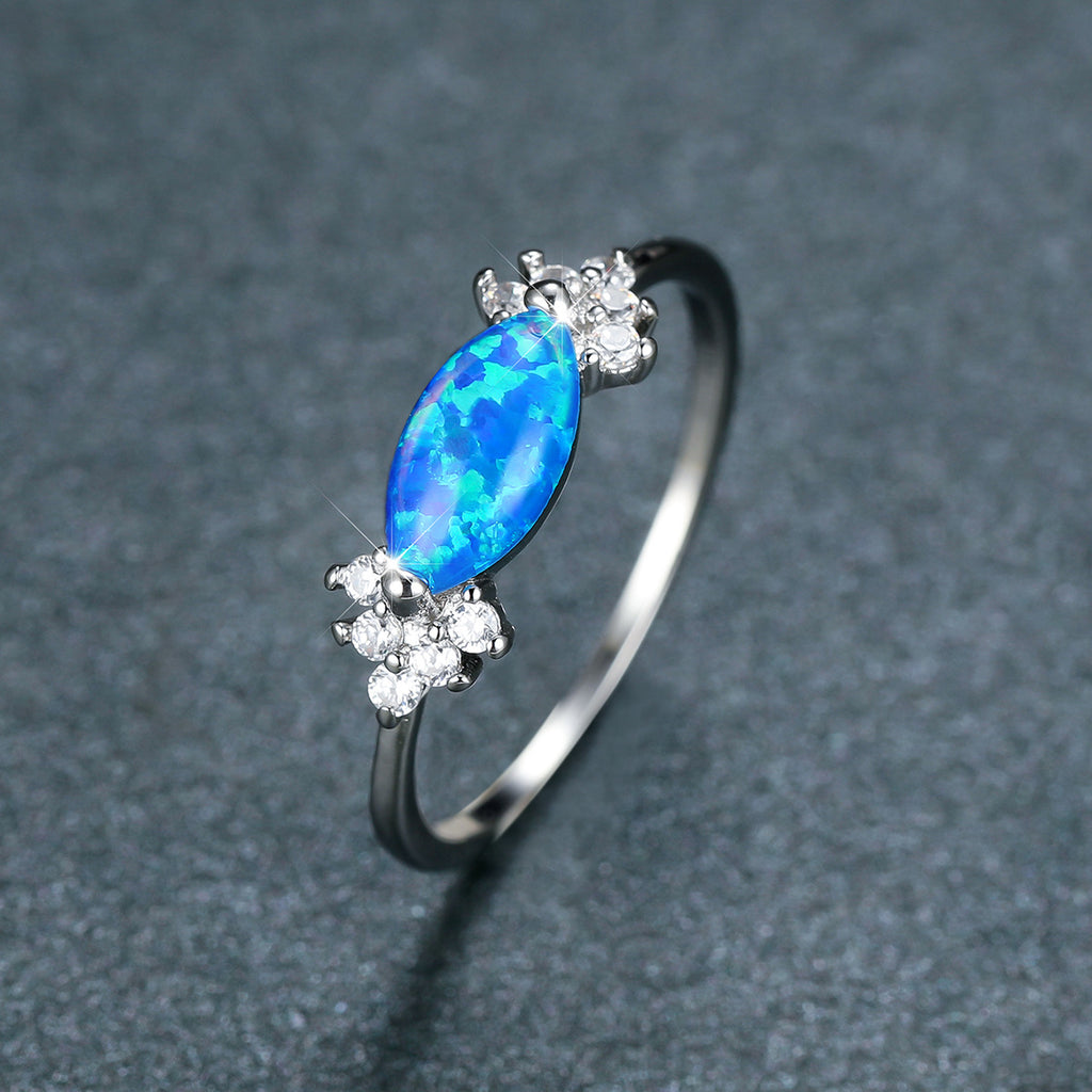 Damen Ring mit schillerndem Opal und funkelnden Zirkonia Shop Nory