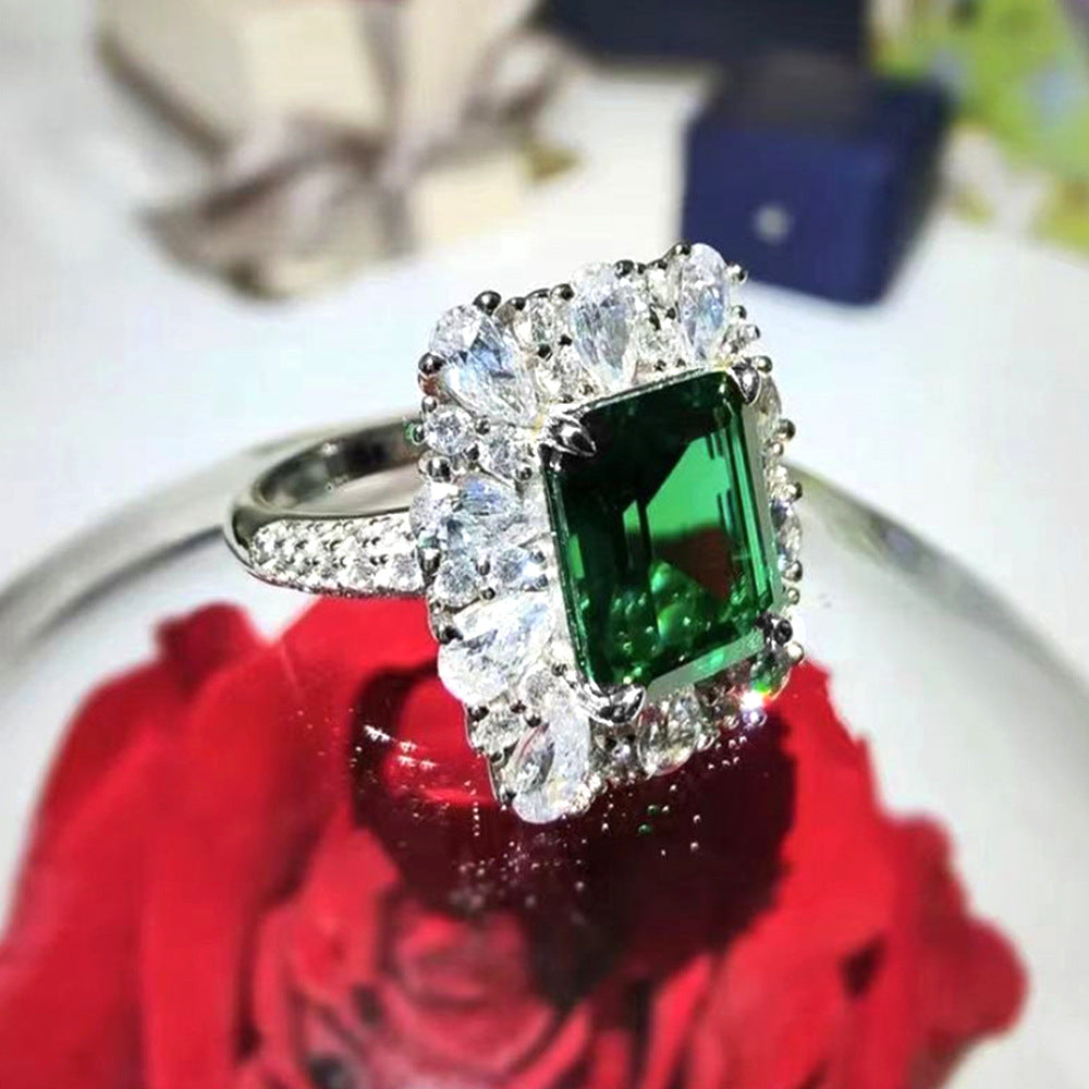 Edelstein-schneider Halo Cocktailring mit Sterlingsilberband und simuliertem Mittelpunktstein sowie Birnen-förmigem Halo
