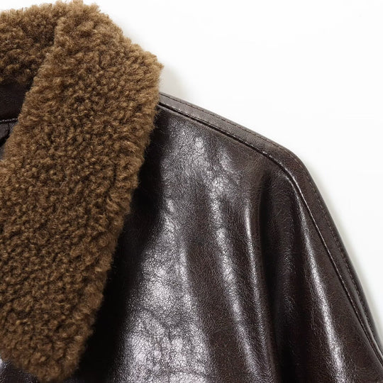 Damen Oversized Lederimitat-Jacke mit Teddykragen und Taillengürtel Shop Nory