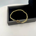 Damen Armband aus feinen, goldfarbenen Kugelperlen Shop Nory