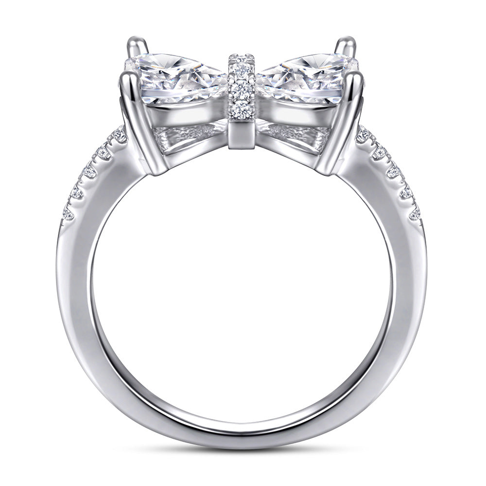 Damen Designer-Ring mit Schleifenmotiv und funkelnden Zirkonia Shop Nory