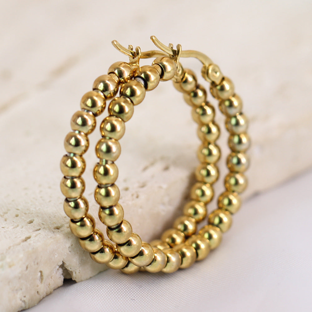 Damen Creolen aus hochwertigem Edelstahl mit glänzenden Kugeldetails Shop Nory