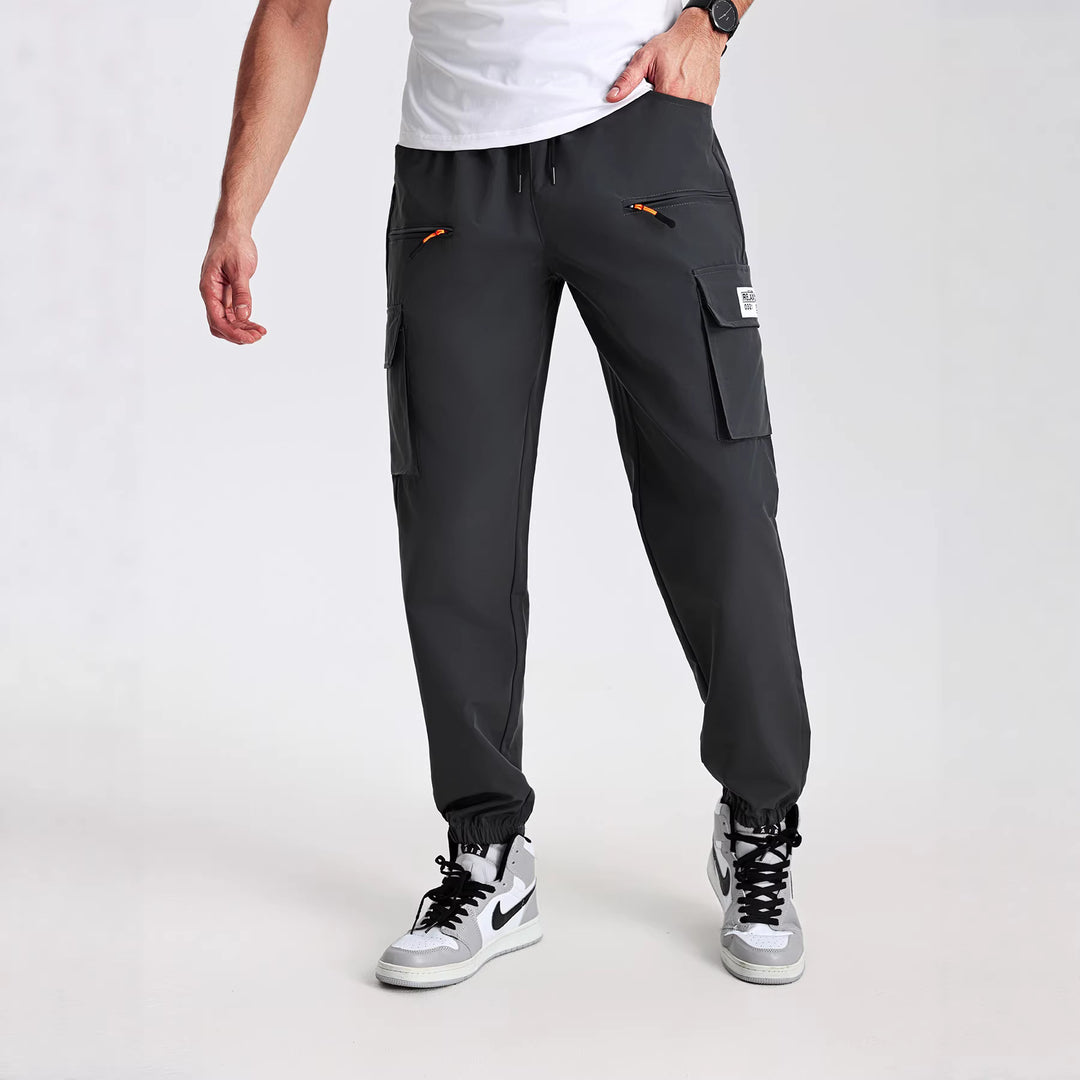 Herren konisch geschnittene Utility-Cargohose im Joggerstil mit Tunnelzugbund, Reißverschlusstaschen & elastischen Beinabschlüssen Shop Nory