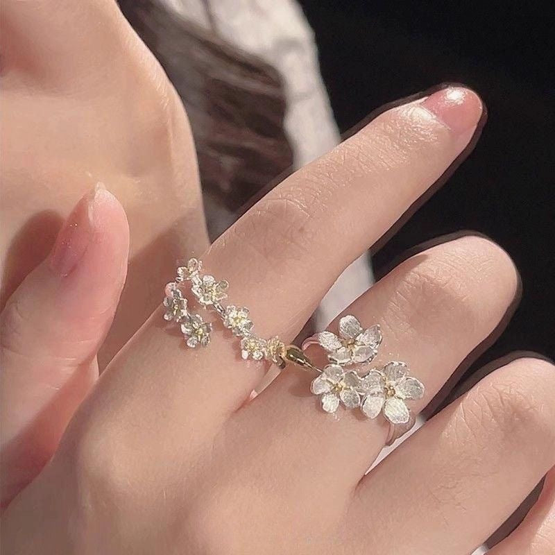 Damen filigraner Blumenring mit funkelnden Zirkonia-Akzenten Shop Nory