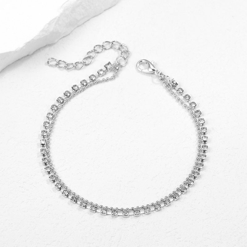 Damen Fußkettchen mit funkelnden Zirkonia und eleganter Gold-Oberfläche Shop Nory