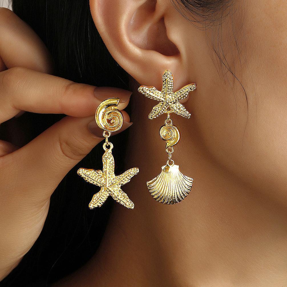 Damen Ohrringe mit maritimem Muschelmotiv und funkelnden Akzenten Shop Nory