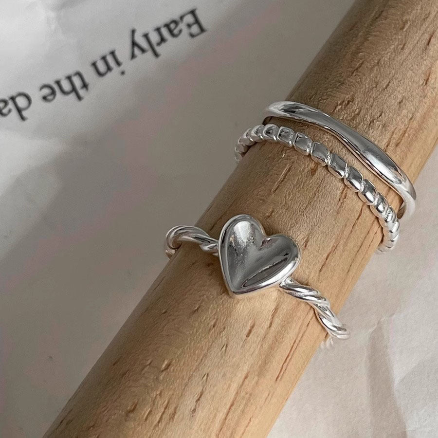 Damen herzförmiger Silberring mit elegantem Drehdesign Shop Nory