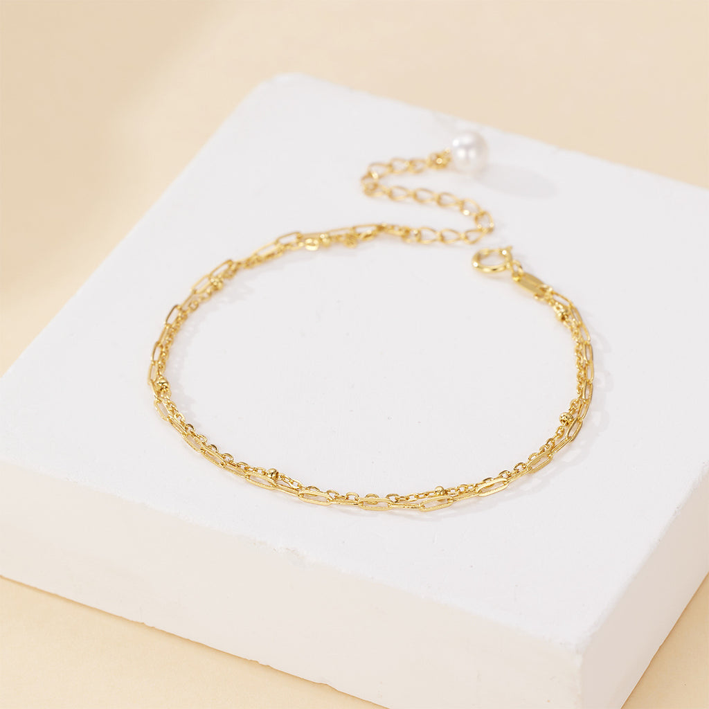 Damen filigranes Armband mit doppeltem Kettendesign, edlen Perlendetails und hochwertiger Verarbeitung Shop Nory