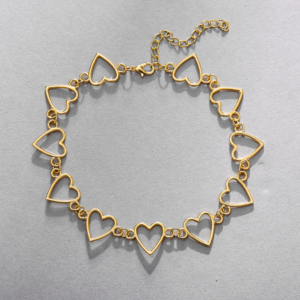Damenarmband mit funkelnden Herzanhängern Shop Nory