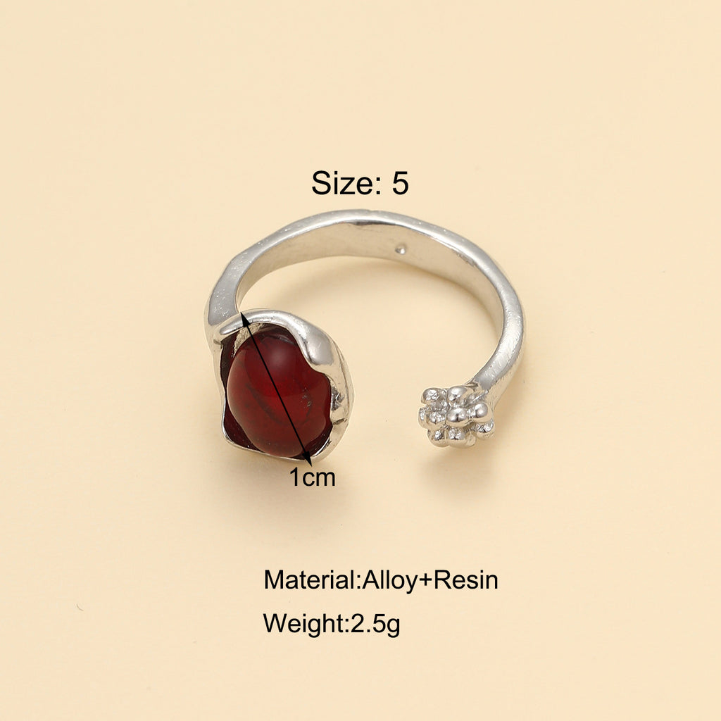 Damenring mit kunstvollem Design und rotem Kristall Shop Nory