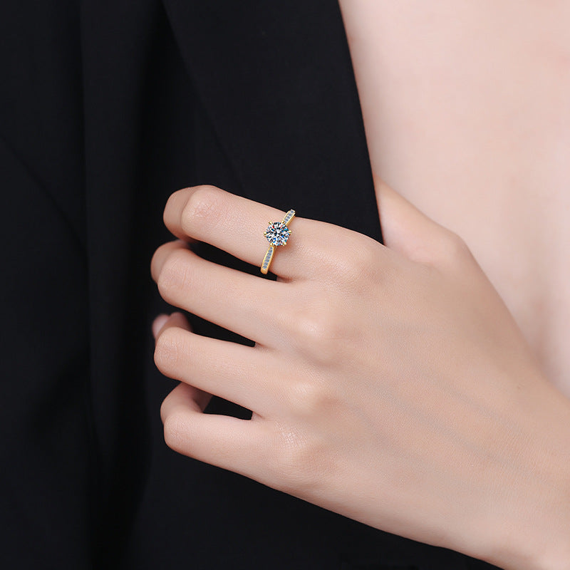Damen Verlobungsring mit funkelndem rundem Zirkonia und luxuriösem Goldrahmen Shop Nory