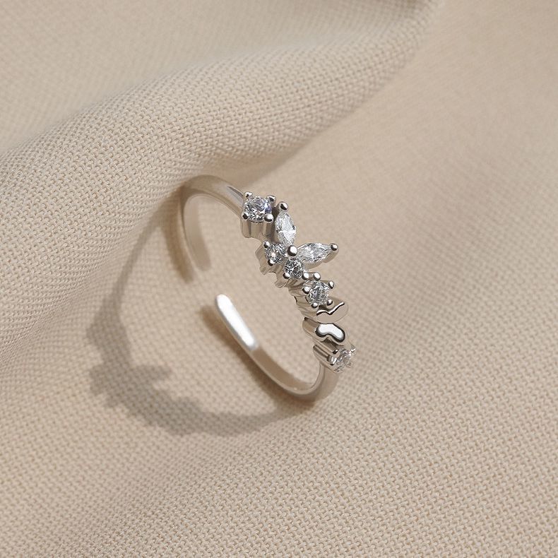 Damen eleganter Ring mit funkelnden Zirkonia und offenem Design Shop Nory