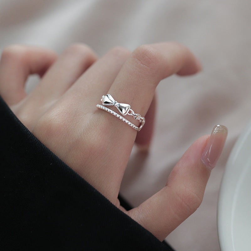 Damen zierlicher Ring mit verspieltem Schleifenmotiv und feinen Zirkonia Akzenten Shop Nory