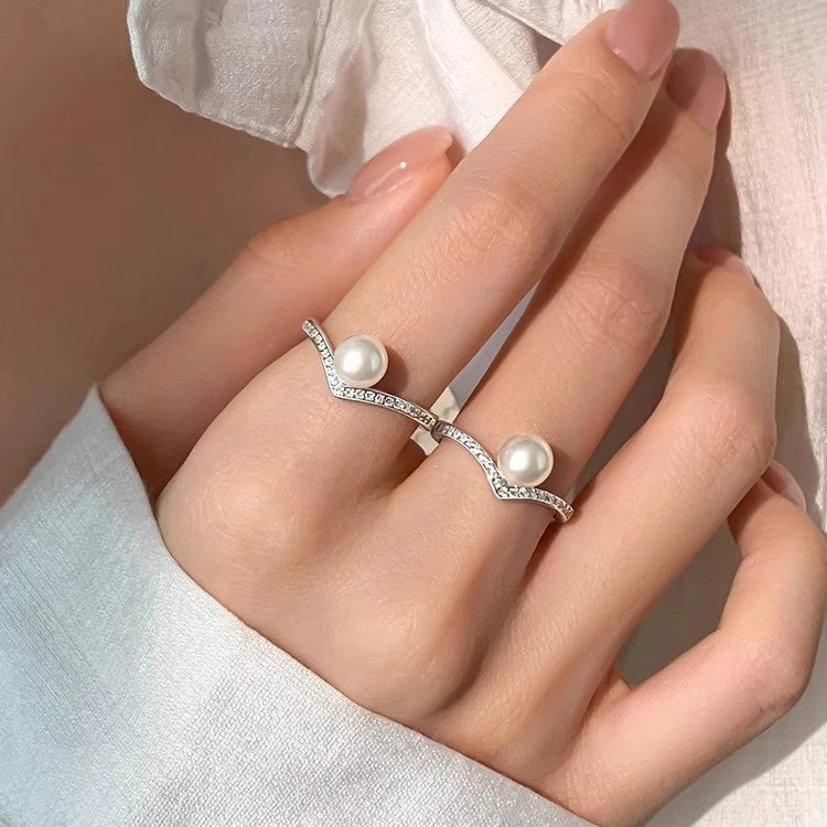 Damen Ring mit modernem geschwungenem Design und Perlenakzent Shop Nory