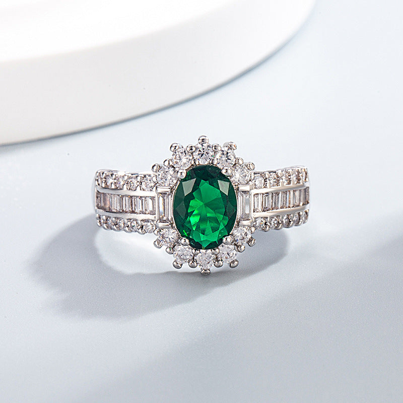 Oval simulierte Edelstein Halo-Verlobungsring mit Mikro Pavé Zirkonia und Baguette-Akzenten