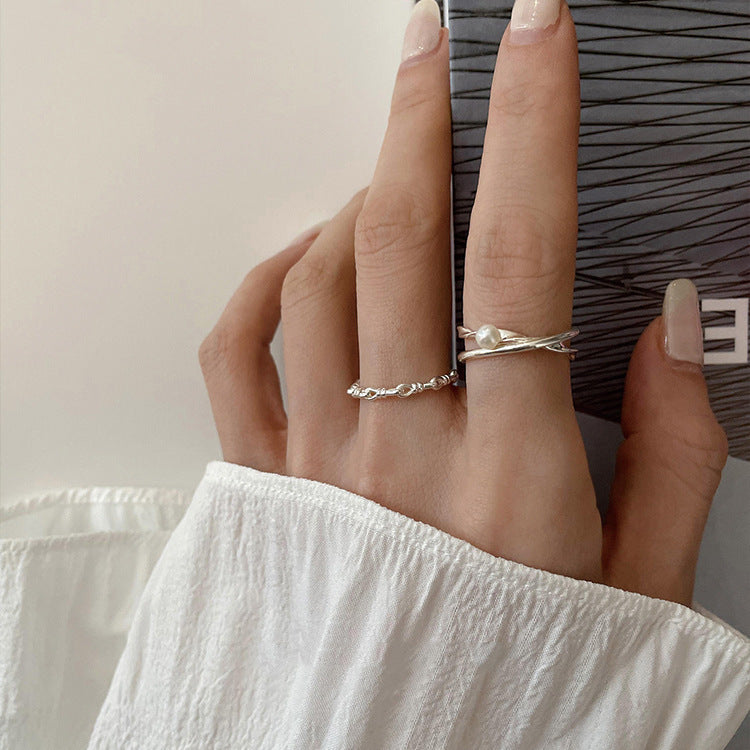 Damen Ring mit elegantem geschwungenem Design und zarter Perle Shop Nory