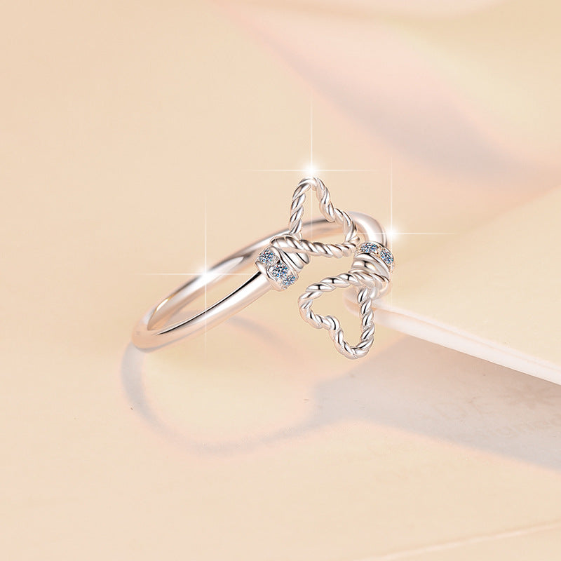 Damenring mit verschnörkeltem Herzdesign und glitzernden Zirkonia Shop Nory