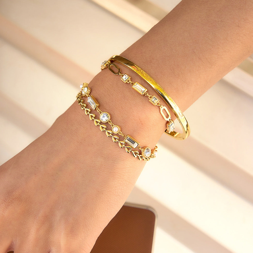 Damen Armband mit funkelnden Kristallen und verstellbarem Edelstahl-Design Shop Nory