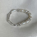Damen eleganter Ring mit Perlen und geschwungenem Design Shop Nory