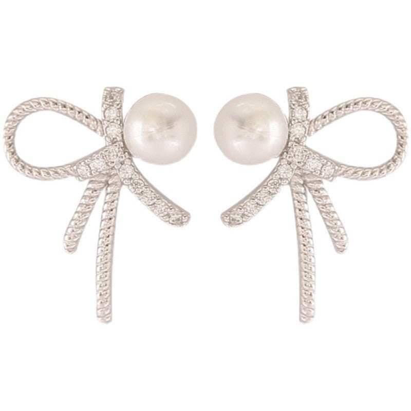 Damen Ohrstecker mit elegantem Schleifenmotiv und Perlenakzent Shop Nory