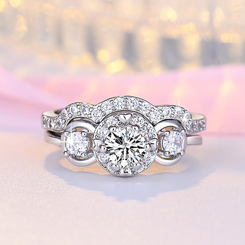 Damen Verlobungsring mit kunstvollem Zirkonia-Besatz und eleganter Wellenstruktur Shop Nory