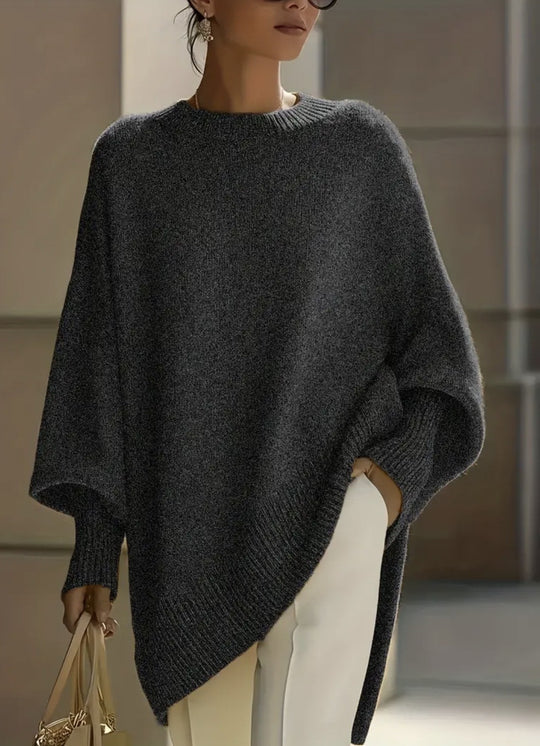 Damen nan Oversize Strickponcho mit asymmetrischem Saum und gerippten Ärmeln Shop Nory