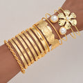 Damen Armreifen-Set mit extravaganten Designs und eleganten Perlenakzenten Shop Nory