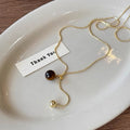 Damen Halskette mit einem einzigartigen Tigeraugen-Anhänger und glänzendem Gold-Design Shop Nory