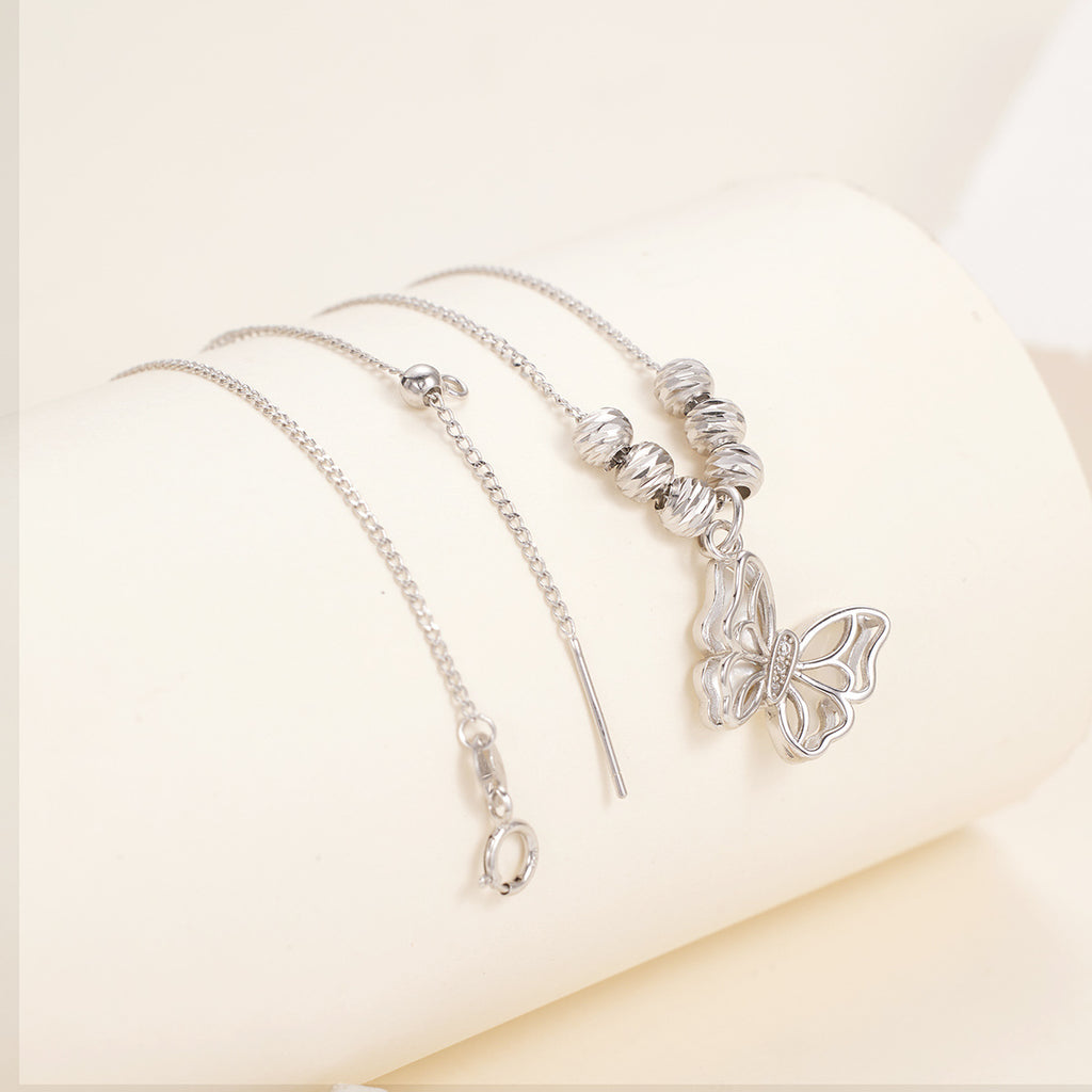 Damen Halskette mit filigranem Schmetterlingsanhänger und eleganten Perlenakzenten Shop Nory