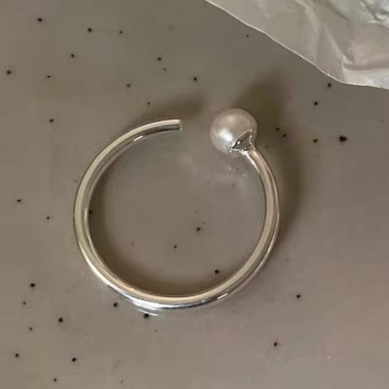 Damenring mit kunstvollem Wellen-Design und funkelnden Akzenten Shop Nory