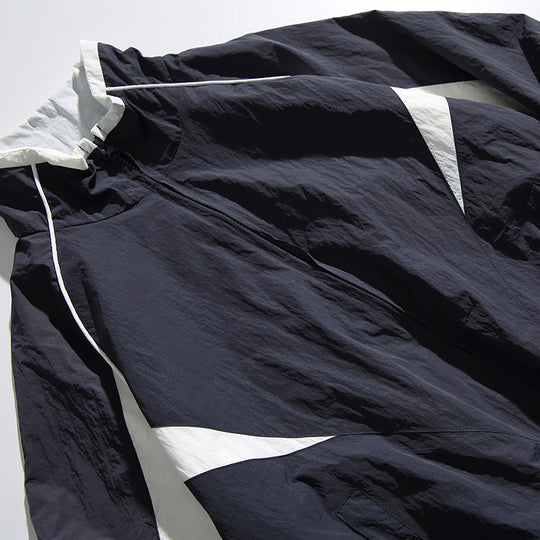 Unisex Leichte Boxy-Kapuzenjacke im Windbreaker-Stil mit Kontrastpaneelen und Raglanärmeln Shop Nory