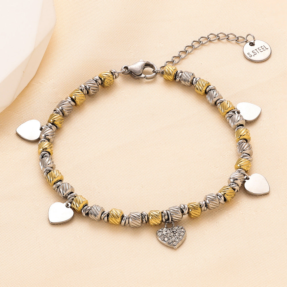 Damen Armband mit herzförmigen Anhängern und funkelndem Zirkonia Shop Nory