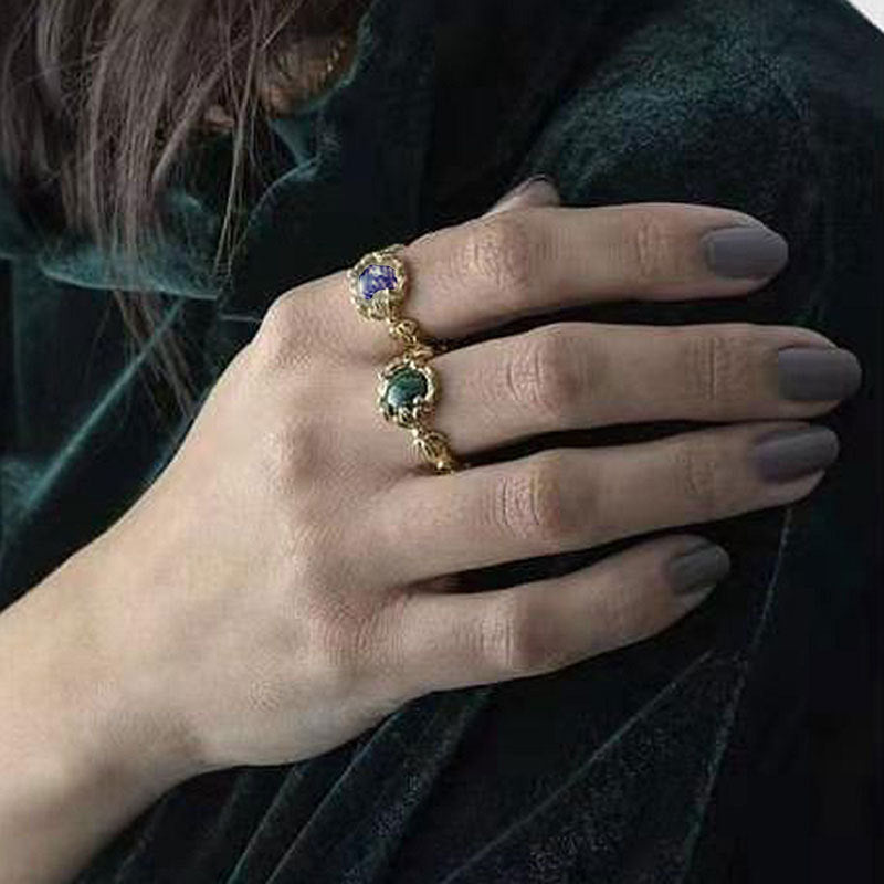 Damenring mit kunstvollem Blumendesign und violettem Edelstein Shop Nory